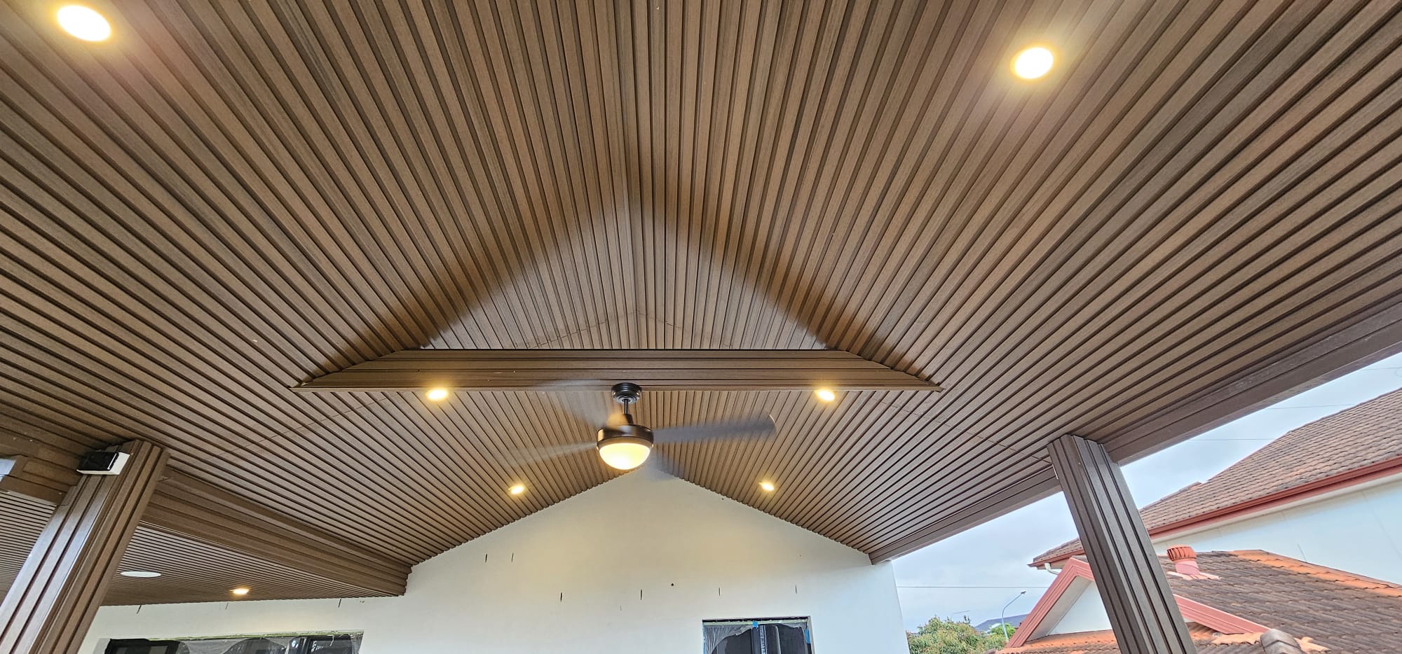 Timber batten pergola ceiling with ceiling fan and recessed downlights