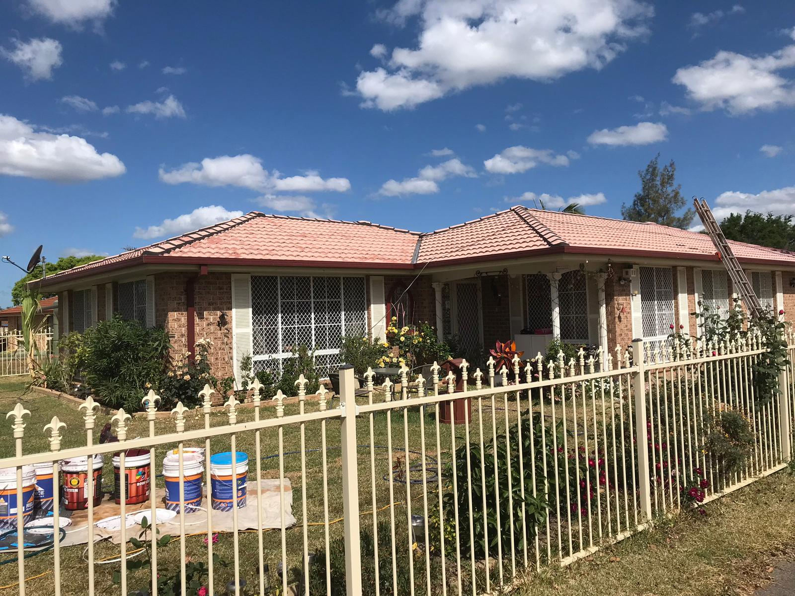 Completed tile roof restoration on brick home