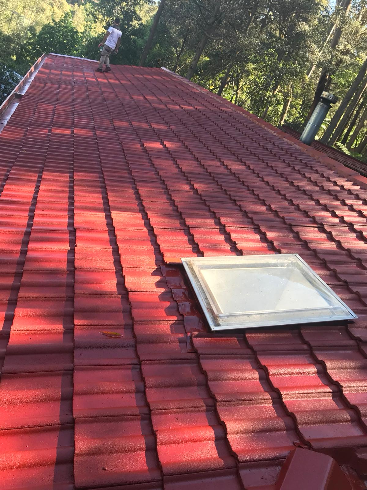 Brick home with freshly restored terracotta roof tiles